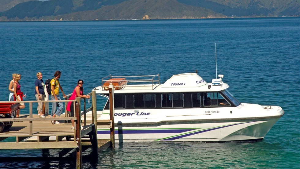 Travellers get ready to board a Cougar Line vessel in the Marlborough Sounds