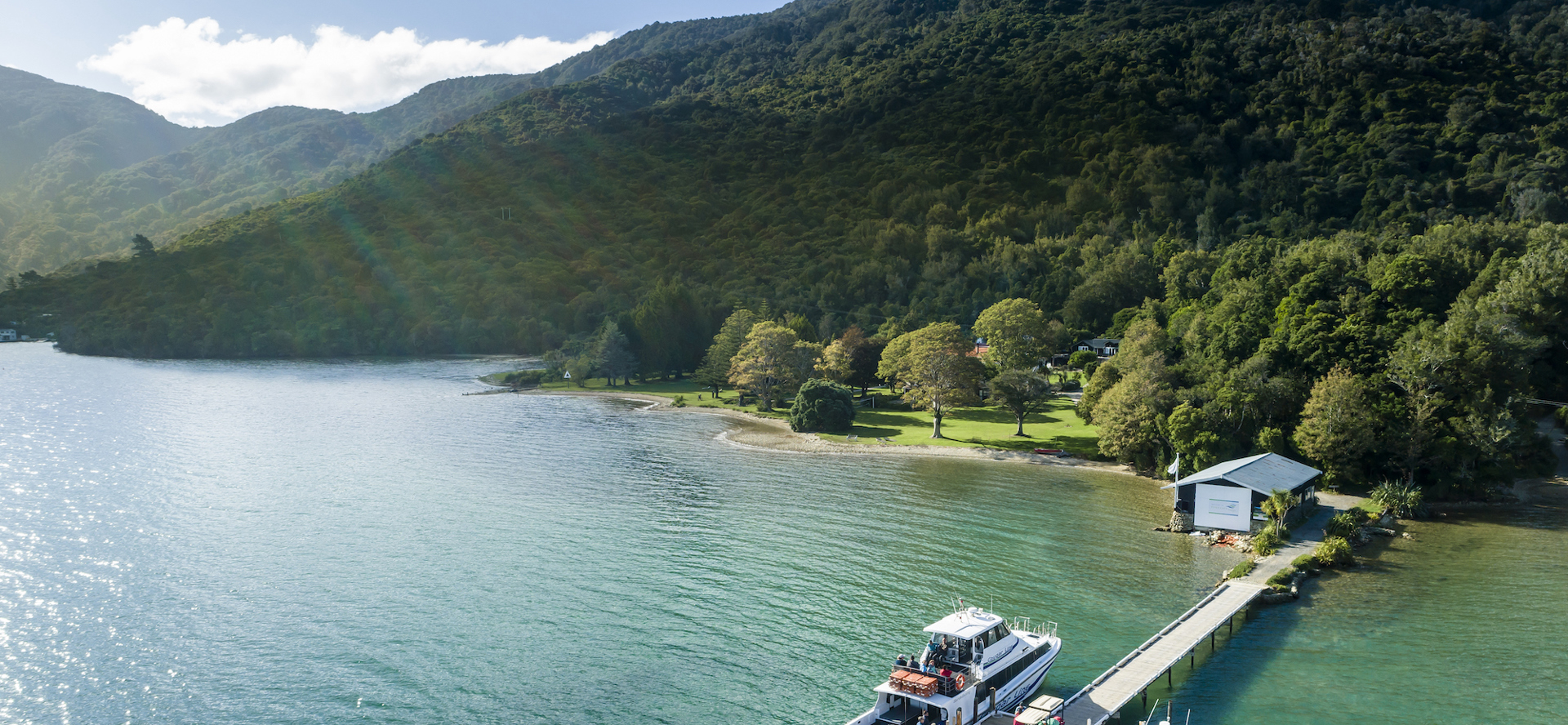 Furneaux Lodge jetty is in the foreground and Furneaux Lodge jetty in the background, in the Marlborough Sounds at the top of New Zealand's South Island.