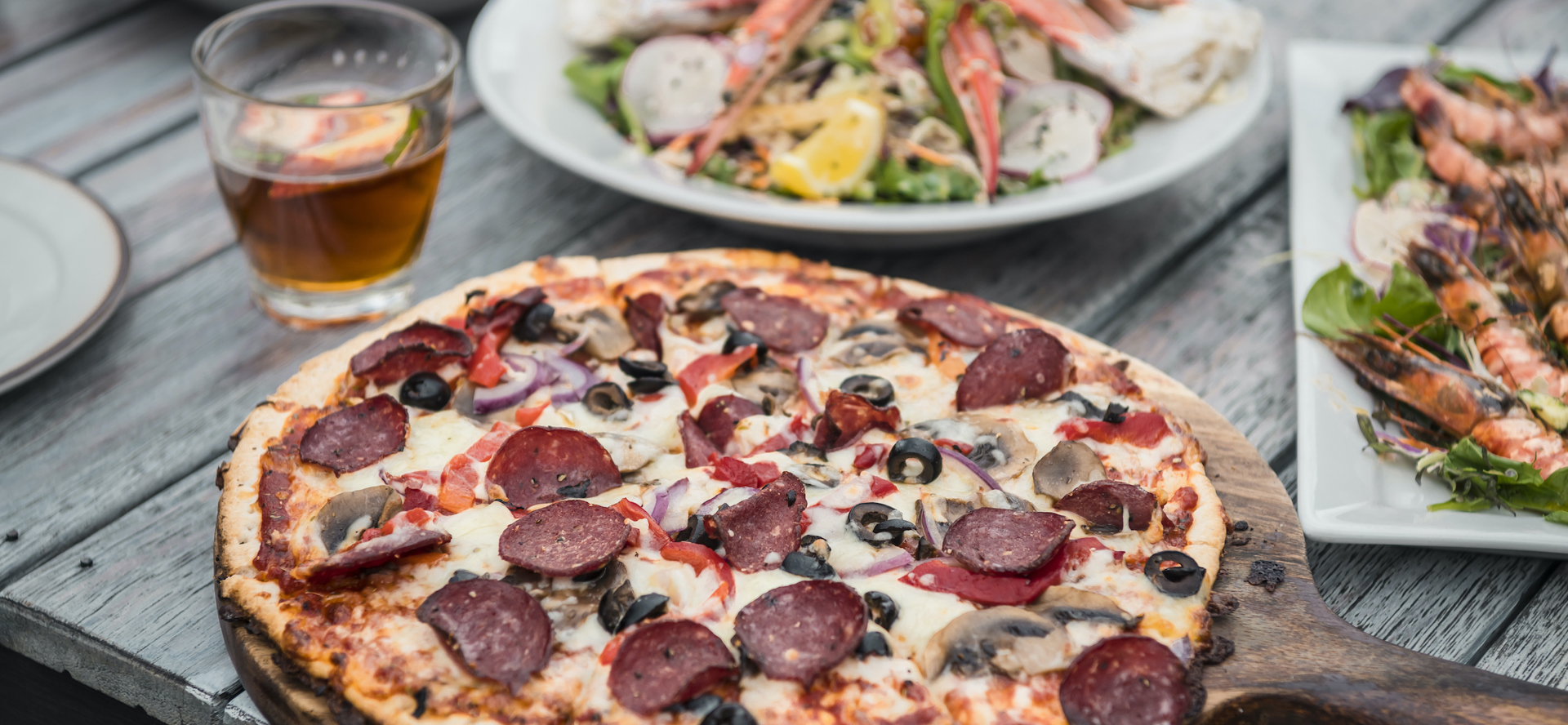 Fresh stone-baked pizza served at Punga Cove in the Marlborough Sounds, New Zealand.