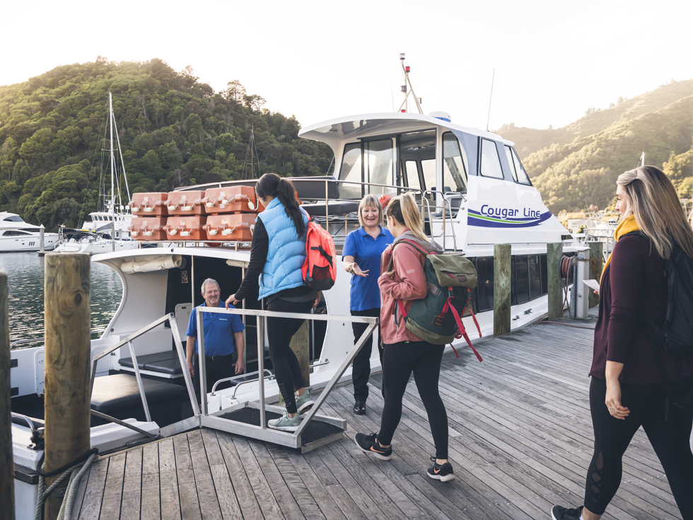Cougar Line passengers board their boat in Picton Marina in the Marlborough Sounds, New Zealand.