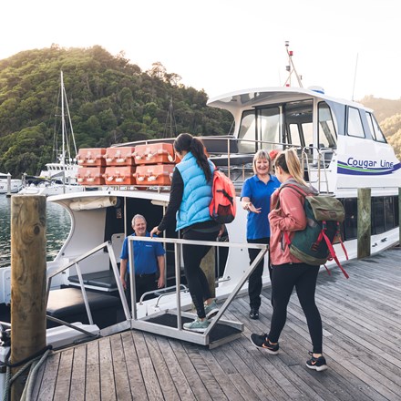Cougar Line passengers board their boat in Picton Marina in the Marlborough Sounds, New Zealand.