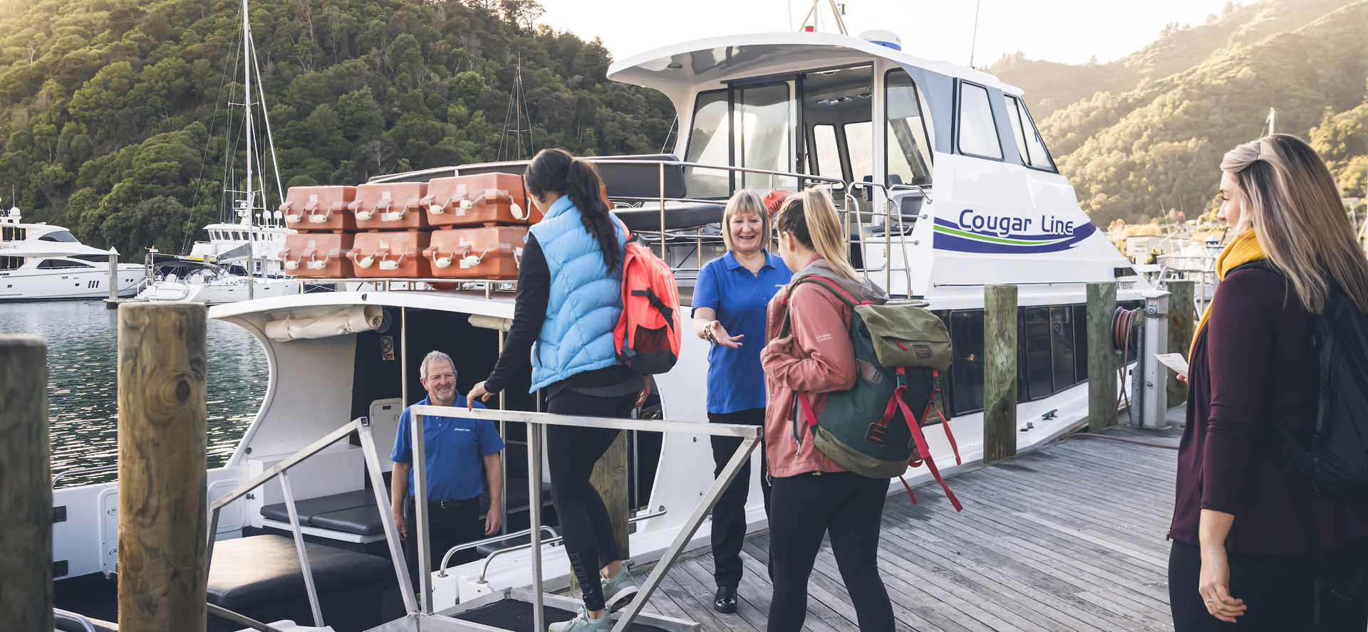 Cougar Line passengers board their boat in Picton Marina in the Marlborough Sounds, New Zealand.